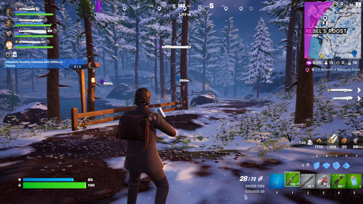 Alan Wake in Fortnite, staring down a snowy path through the woods