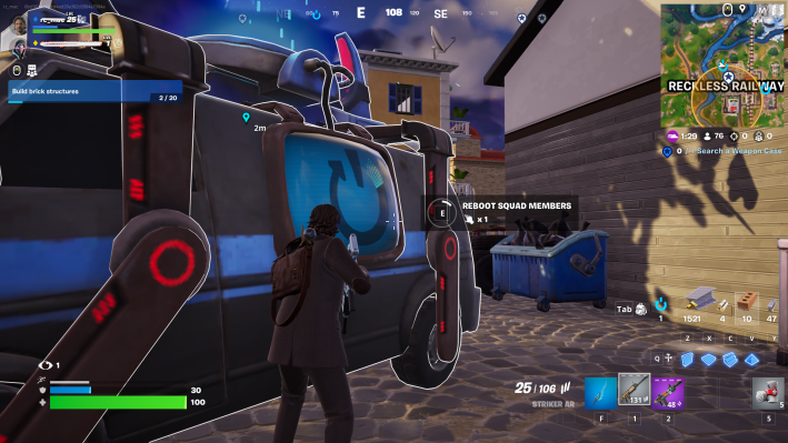 Alan Wake in Fortnite, rebooting a squadmate at one of the game's black-and-blue reboot vans