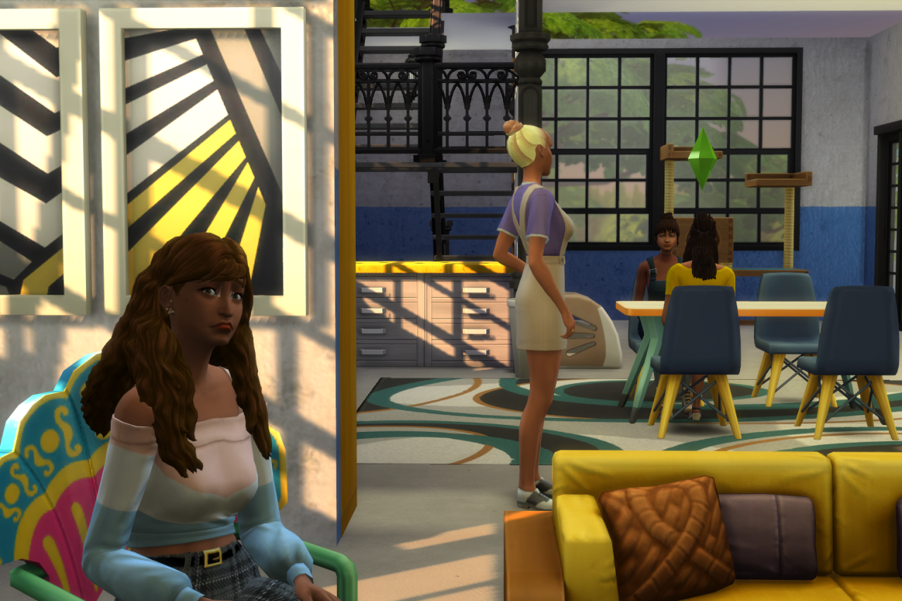 A screenshot of the Sims 4 depicting a woman sitting on a chair in a hip looking living room, kinda like the one I used to live in and blog in, in my twenties