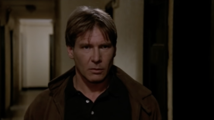 A screenshot from the movie "Regarding Henry:" Harrison Ford standing in a dark hallway