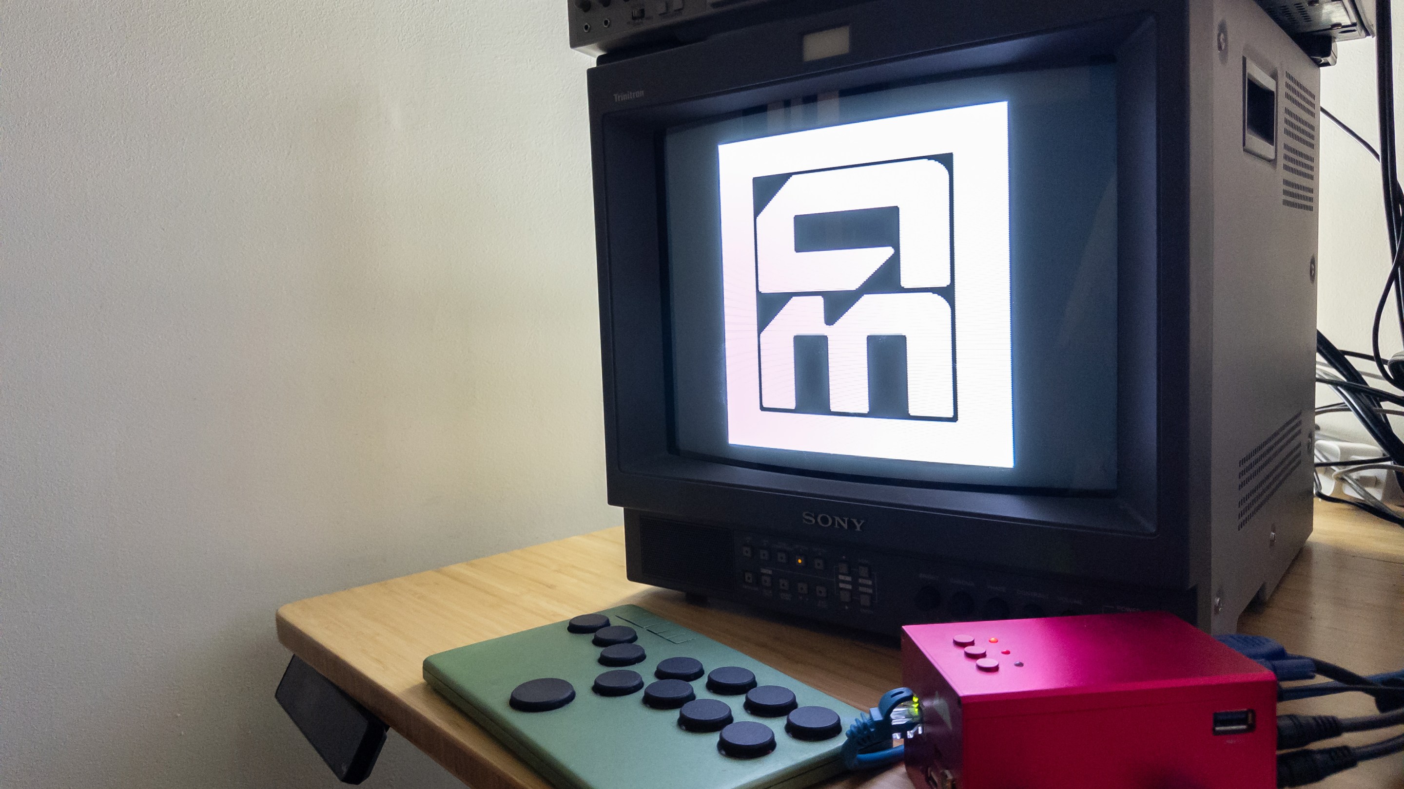A MiSTer and Flatbox controller streaming the Aftermath logo on to a CRT.