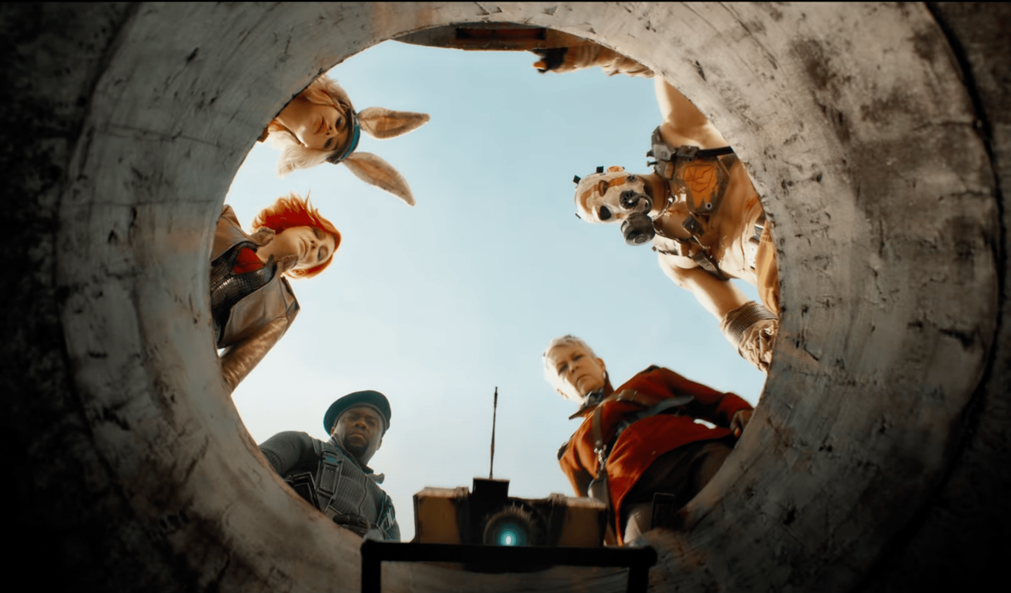 A screenshot from the Borderlands movie trailer: five characters peer at the viewer from the top of a cement hole