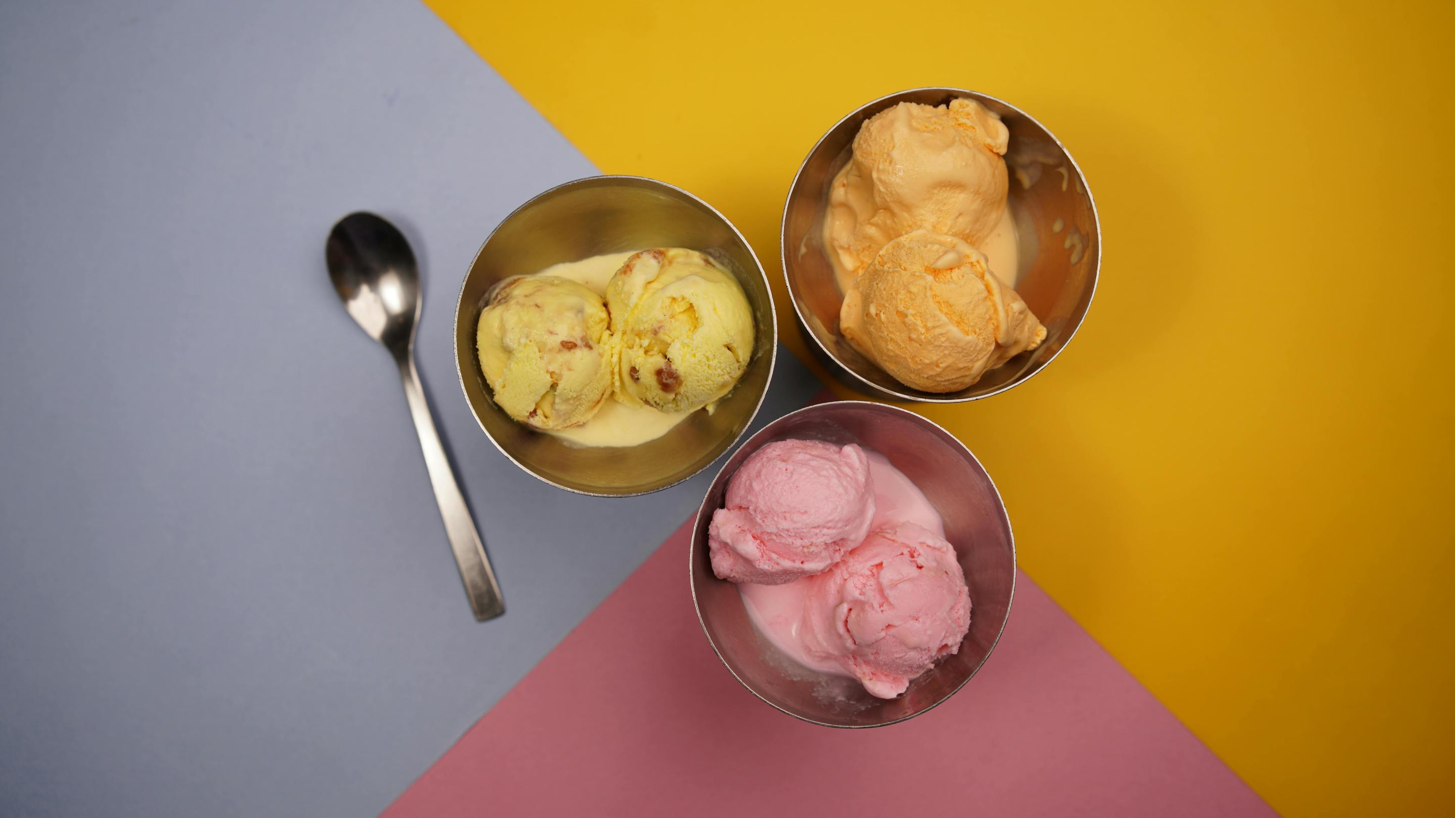 Three bowls of ice cream, seen from above