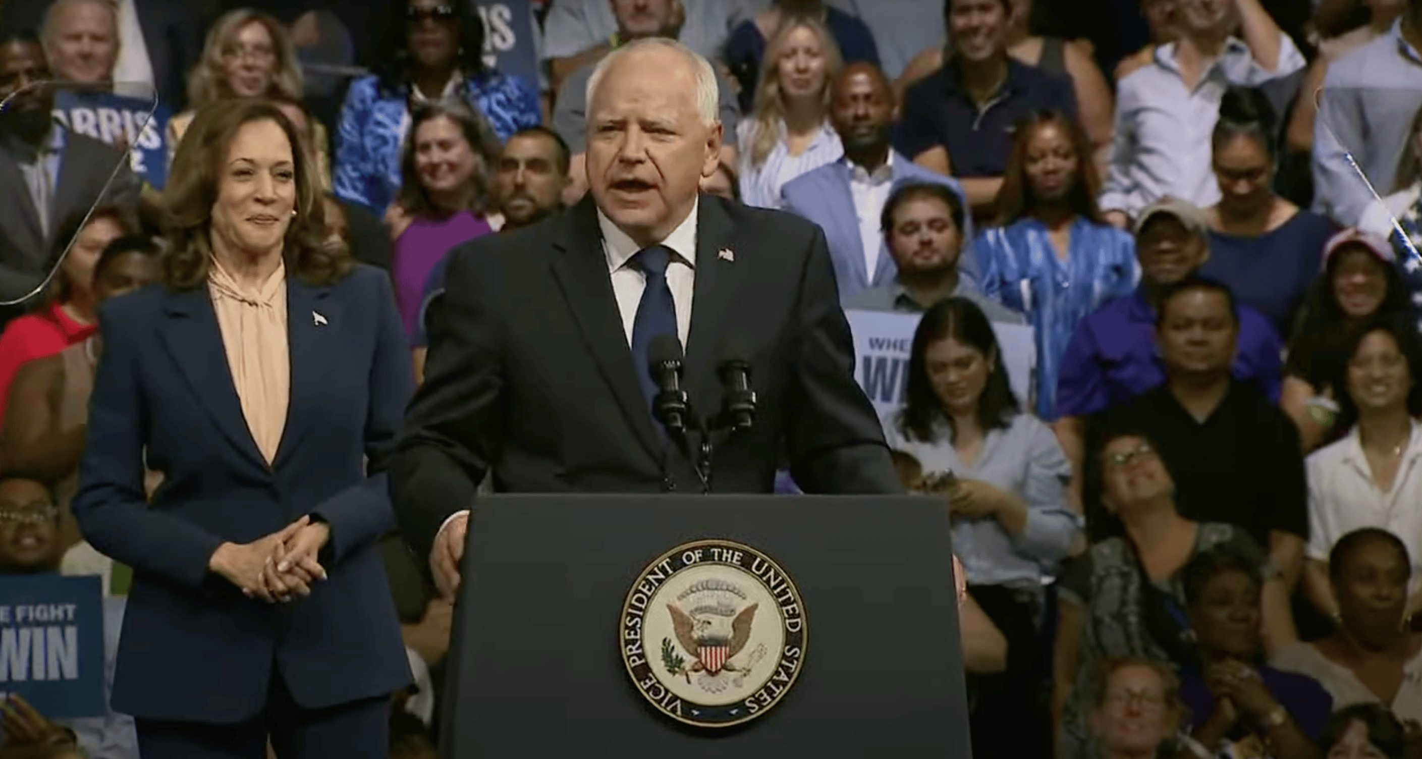 Tim Walz addresses a crowd at a rally in Philadelphia