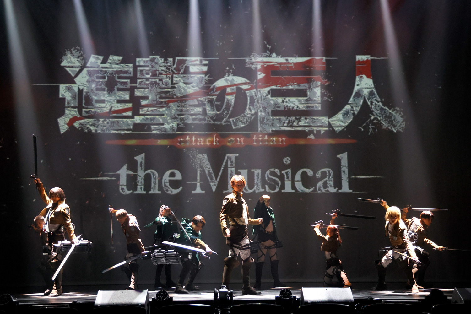 image from attack on titan the musical featuring the main cast in their survey corps uniform