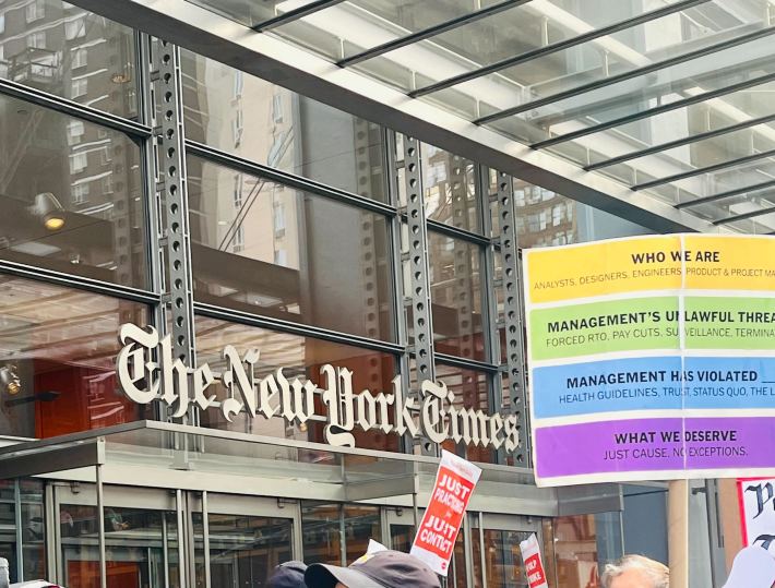 A sign styled after the Times' Connections game next to the front of the building