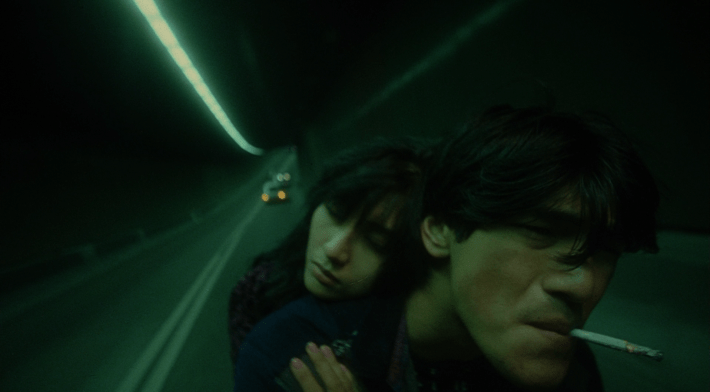 The last shot of fallen angels where they are in the blue-green tunnel on a motorcycle.