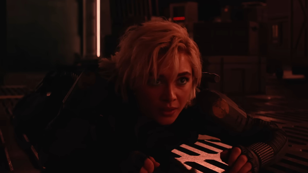 Florence Pughs' Yelena Belova crouched on the ground of a red room in Thunderbolts.