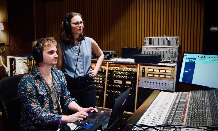 Lorien Testard and Alice Duport-Percier working together in a recording studio.
