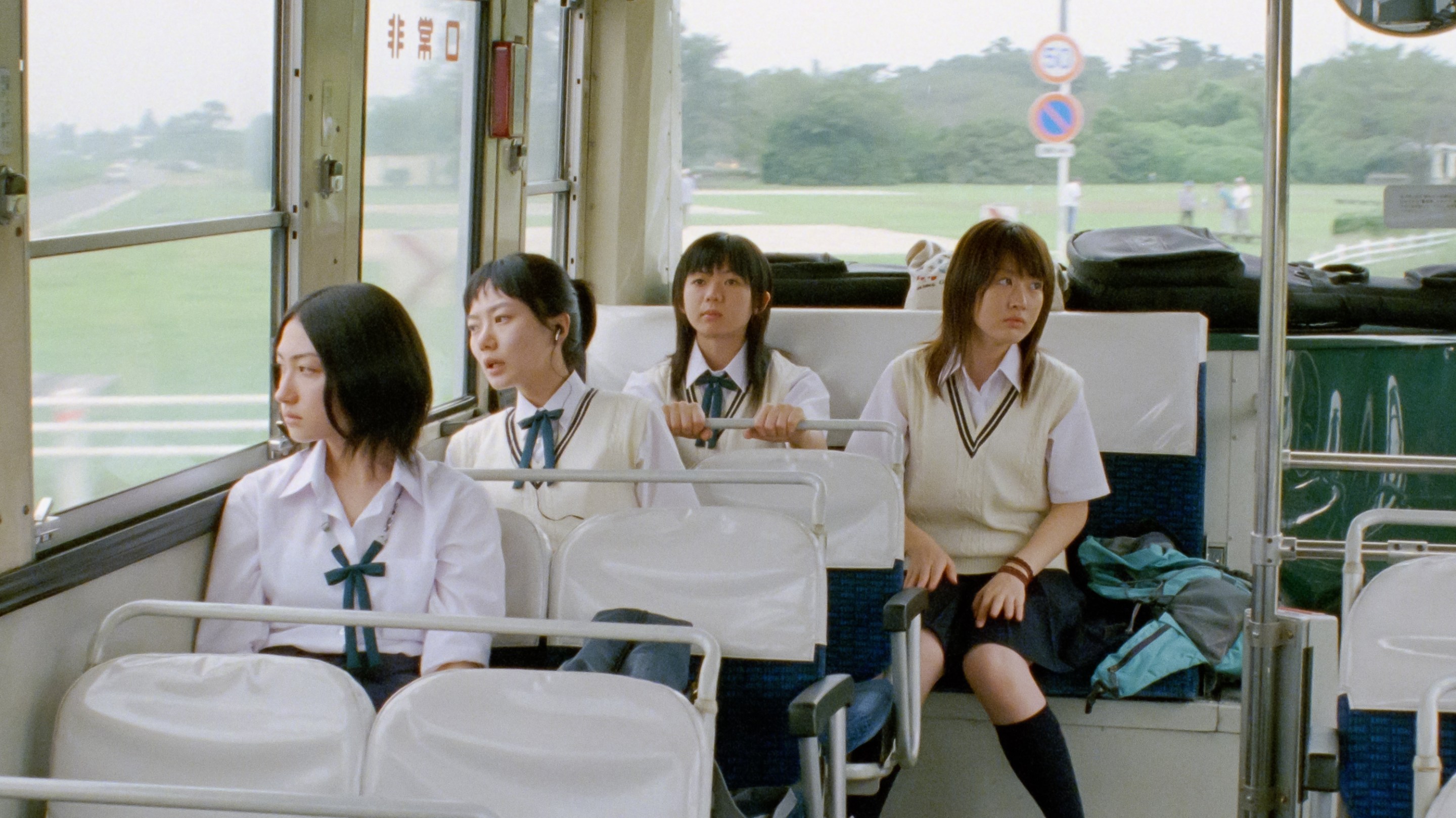 the four main characters of linda linda linda on a bus