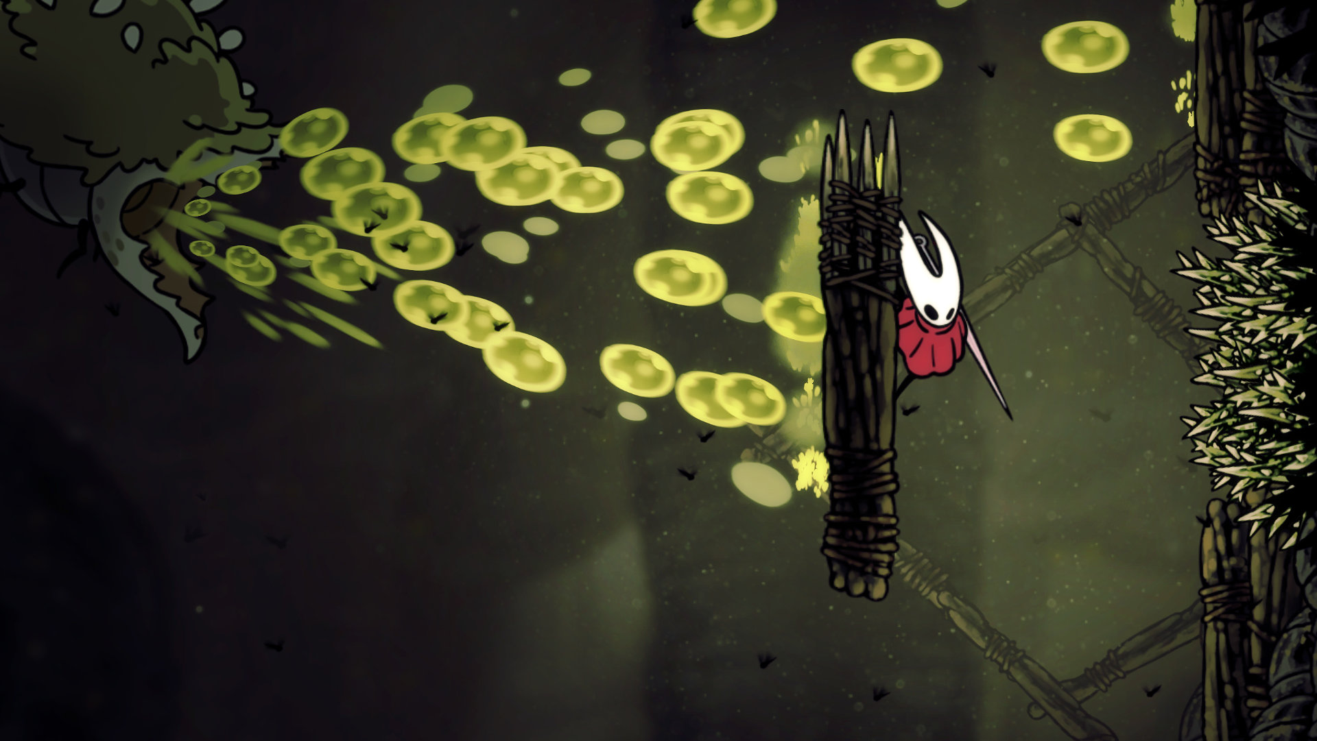 A giant insect spews a green viscous fluid at Hornet as she clings to the wall. Spikes are on the opposing wall.